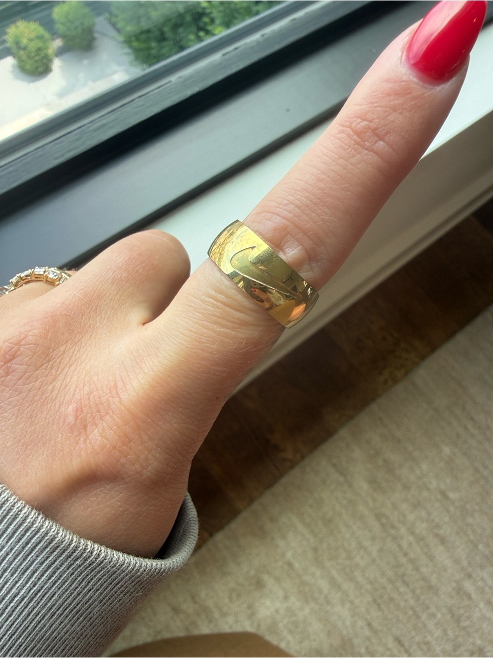 Nike Gold Tone Wide Band Ring with Engraved Swoosh